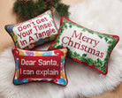 Christmas Embroidered Needlepoint Throw Pillow shown alongside other designs in the same collection, 9x16 inch