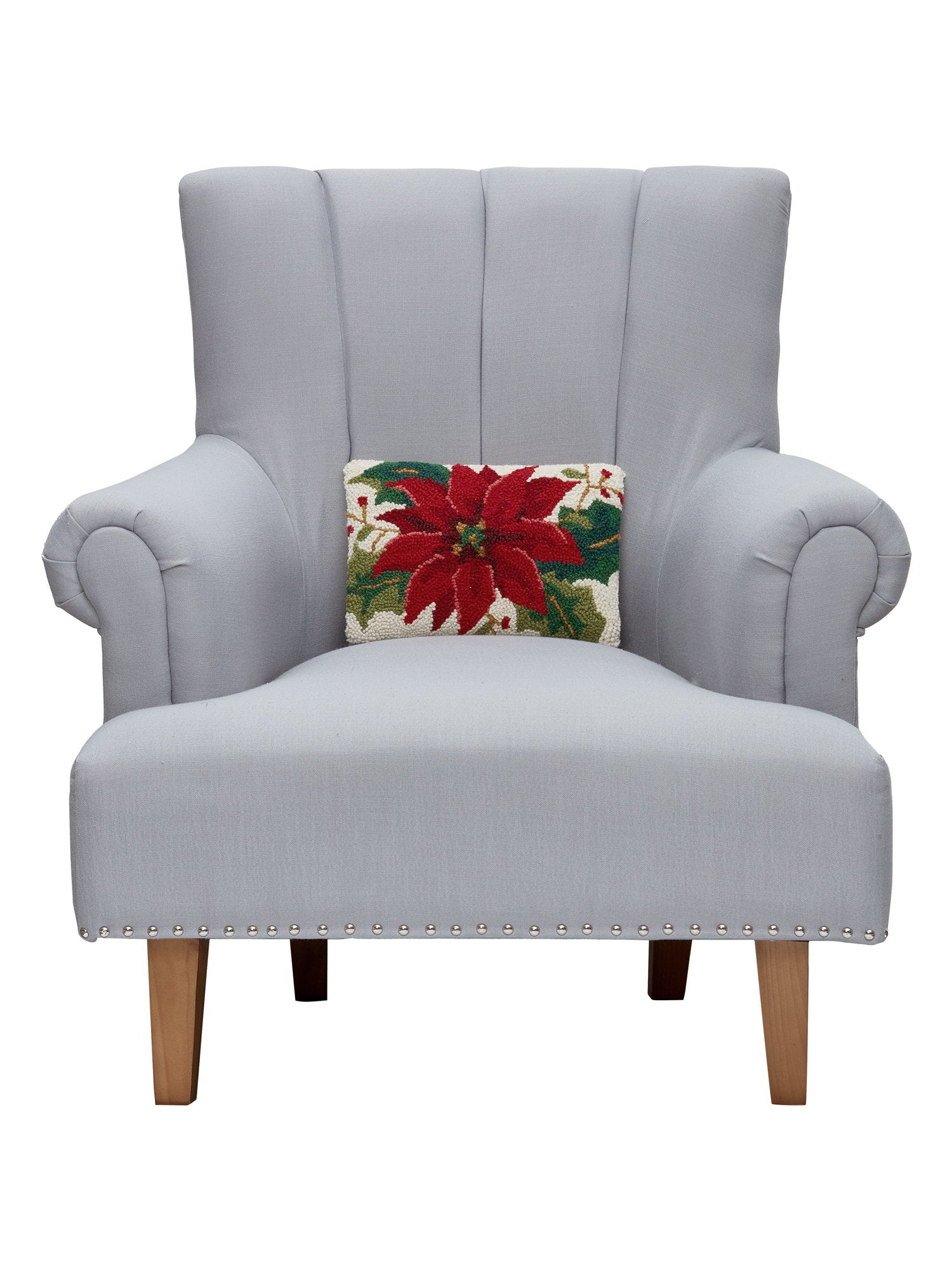 Christmas Poinsettia Hooked Wool Throw Pillow on an armchair, showing the throw pillow at room scale, 8x12 inch