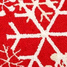 Closeup of Christmas Snow Flakes Red Background Wool Hooked needlepoint throw pillow highlighting hand-stitched wool craftsmanship and fabric detail