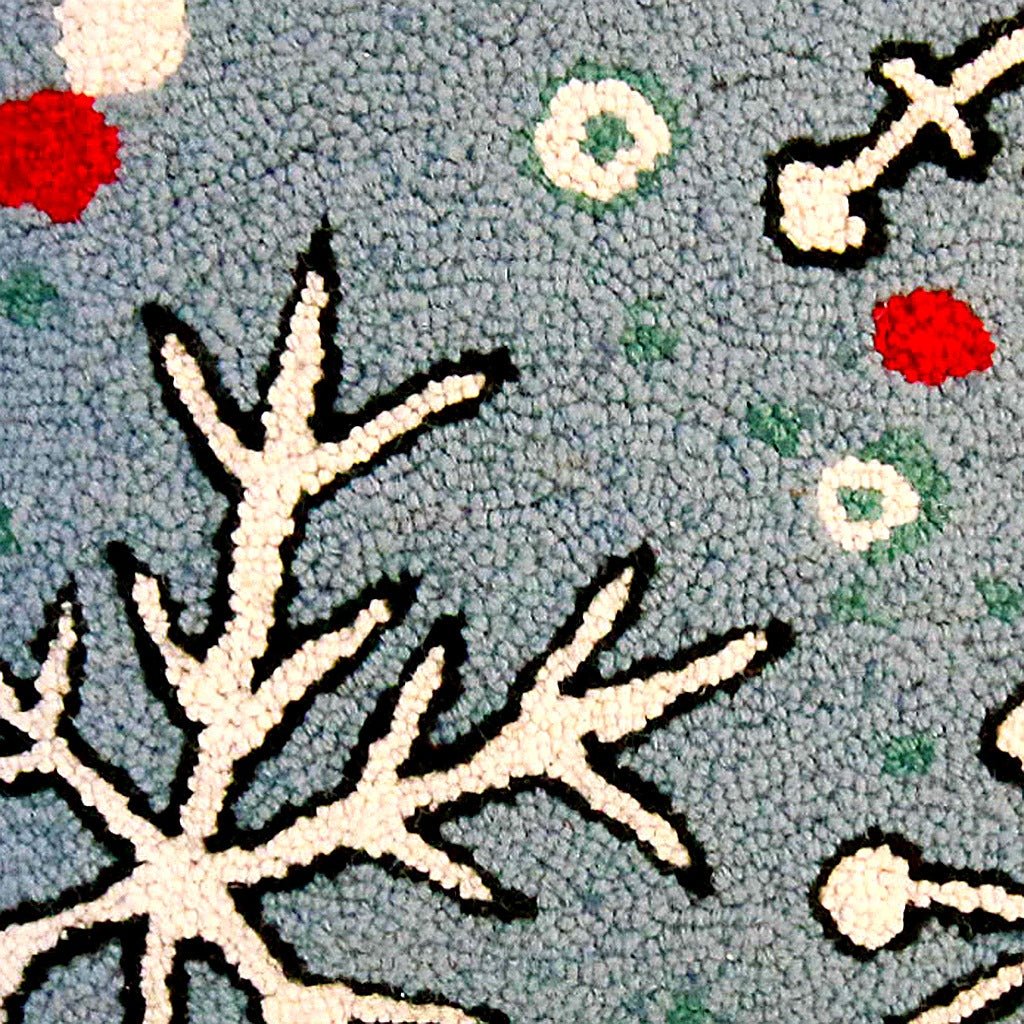 Closeup of Christmas Snowflake Holly Leaves Holiday Wool Hooked needlepoint throw pillow highlighting hand-stitched wool craftsmanship and fabric detail