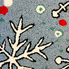 Closeup of Christmas Snowflake Holly Leaves Holiday Wool Hooked needlepoint throw pillow highlighting hand-stitched wool craftsmanship and fabric detail