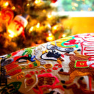 Christmas South Pole Holiday City Embroidered Pillow - close-up detail of hand-embroidered needlepoint stitching