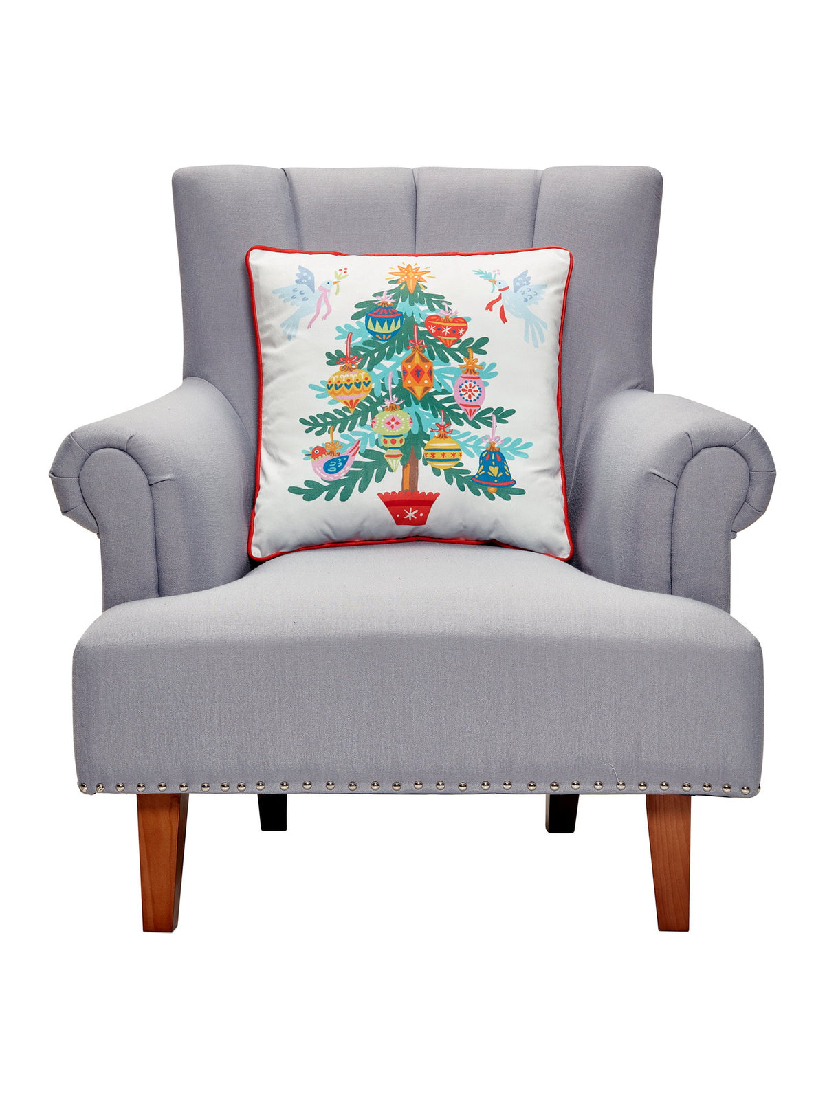 Christmas Tree Printed Throw Pillow on an armchair, showing the throw pillow at room scale, 18x18 inch
