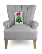 Christmas Tree Ribbon Hooked Wool Throw Pillow on an armchair, showing the throw pillow at room scale, 8x12 inch