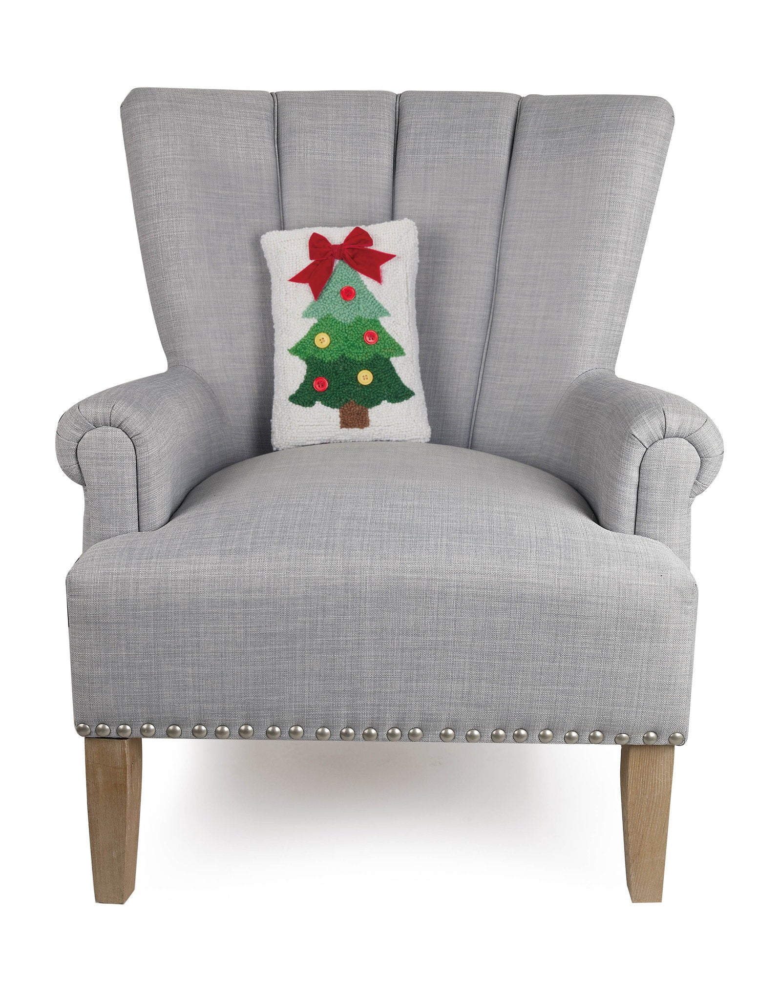 Christmas Tree Ribbon Hooked Wool Throw Pillow on an armchair, showing the throw pillow at room scale, 8x12 inch