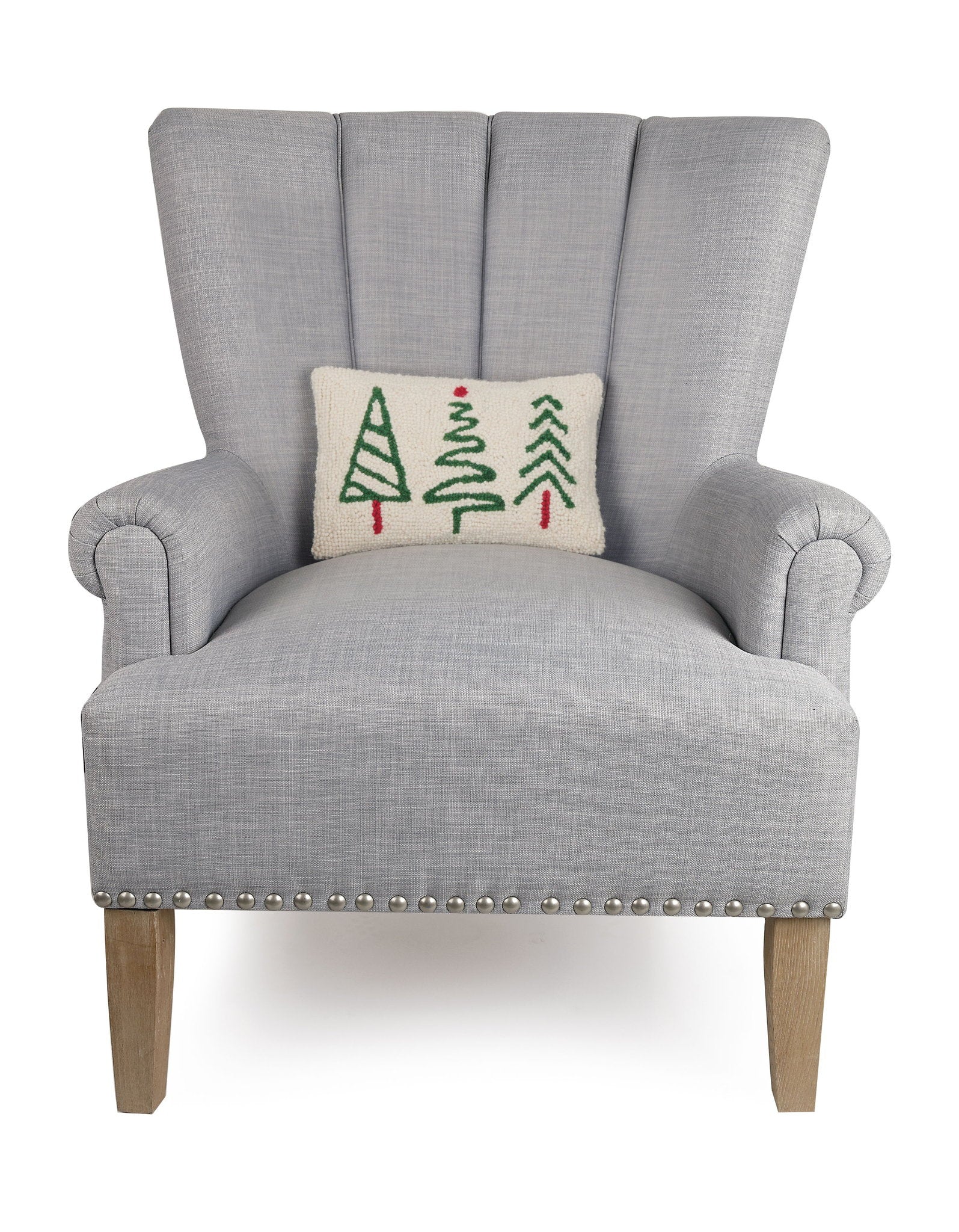 Christmas Trees Trio Hooked Wool Throw Pillow on an armchair, showing the throw pillow at room scale, 8x12 inch