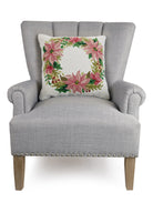 Christmas Wreath Hooked Wool Throw Pillow on an armchair, showing the throw pillow at room scale, 18x18 inch