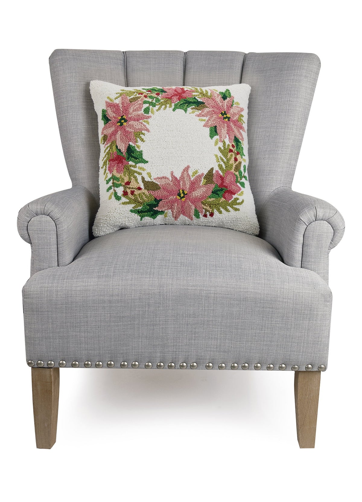 Christmas Wreath Hooked Wool Throw Pillow on an armchair, showing the throw pillow at room scale, 18x18 inch