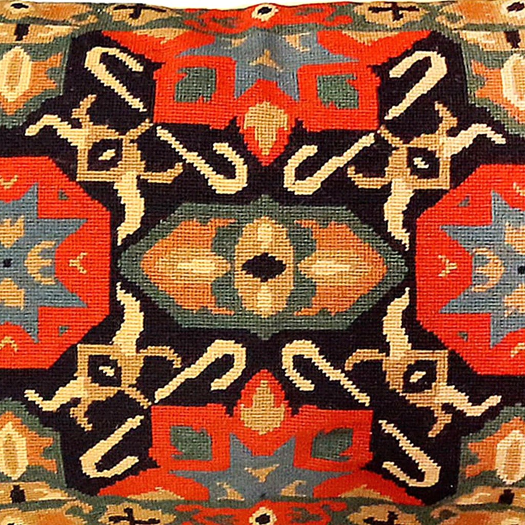 Closeup of Classic Navy Orange Vintage Turkish Ararat needlepoint throw pillow highlighting hand-stitched wool craftsmanship and fabric detail