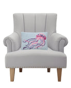 Coastal Jellyfish Hooked Wool Throw Pillow on an armchair, showing the throw pillow at room scale, 8x12 inch