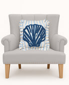 Coastal Shell Tufted Hooked Throw Pillow on an armchair, showing the throw pillow at room scale, 16x16 inch