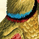 Hand-stitched wool detail of Colorful Parrot Wildlife Bird Lodge needlepoint pillow showing intricate weave pattern and texture