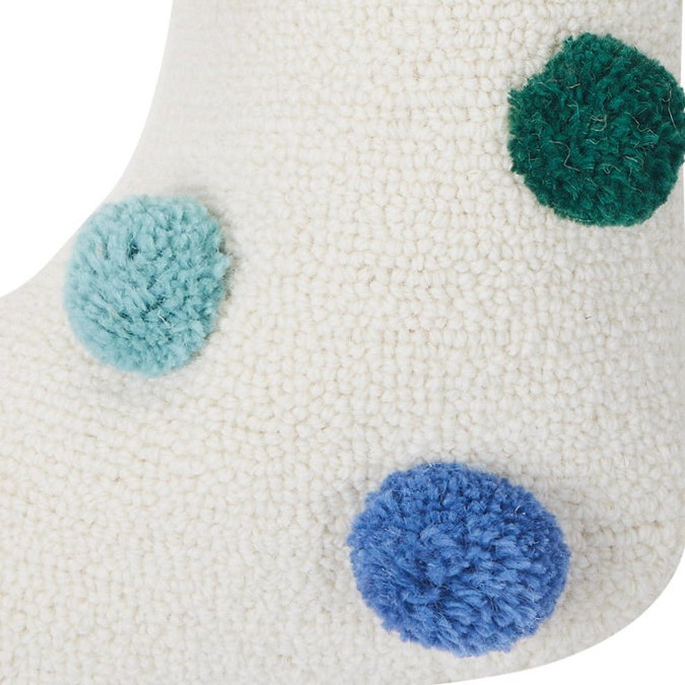 Closeup of Colorful Pom Poms II Hooked Christmas Stocking showing stitch texture and craftsmanship detail