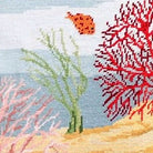 Hand-stitched wool detail of Coral Reef Ocean Fish needlepoint pillow showing intricate weave pattern and texture