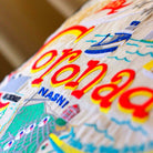 Coronado, CA Beach Town Embroidered Travel Pillow - close-up detail of hand-embroidered needlepoint stitching