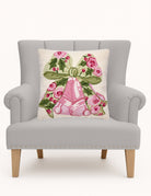 Cottage Charm Bells Hooked Wool Christmas Throw Pillow on an armchair, showing the throw pillow at room scale, 18x18 inch