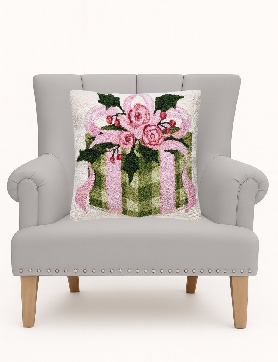 Cottage Charm Gift Hooked Wool Christmas Throw Pillow on an armchair, showing the throw pillow at room scale, 18x18 inch