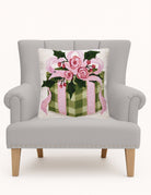 Cottage Charm Gift Hooked Wool Christmas Throw Pillow on an armchair, showing the throw pillow at room scale, 18x18 inch