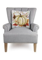Cream Harvest Pumpkin Hooked Wool Fall Harvest Throw Pillow on an armchair, showing the throw pillow at room scale, 18x18 inch
