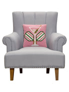 Crossed Paddles Martini Hooked Wool Throw Pillow on an armchair, showing the throw pillow at room scale, 14x14 inch