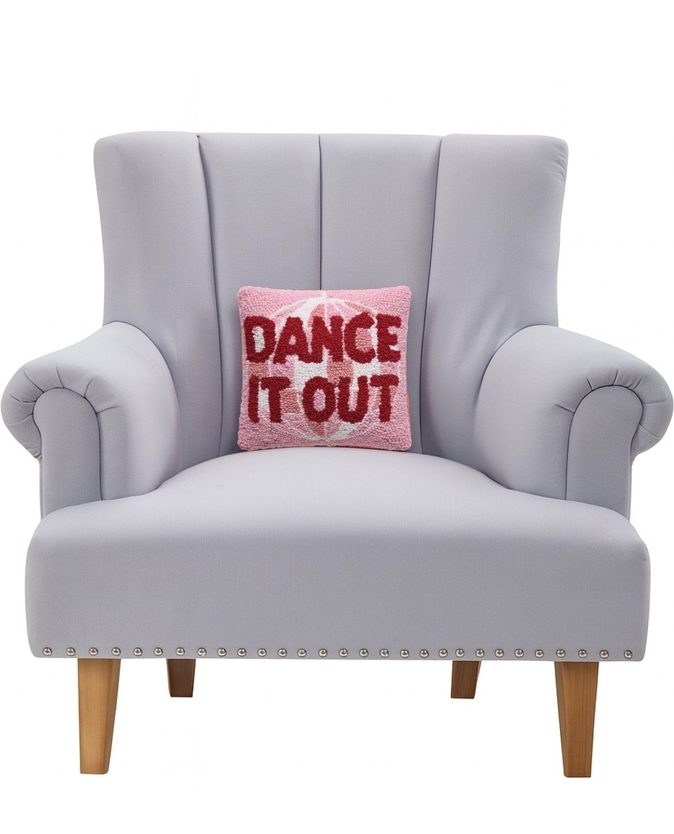 Dance It Out Hooked Wool Throw Pillow on an armchair, showing the throw pillow at room scale, 10x10 inch