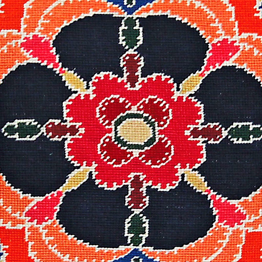 Closeup of Dark Blue Red Designer Floral needlepoint throw pillow highlighting hand-stitched wool craftsmanship and fabric detail