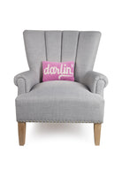 Darlin Hooked Wool Throw Pillow on an armchair, showing the throw pillow at room scale, 8x12 inch