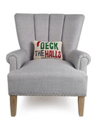 Deck the Halls Hooked Wool Christmas Throw Pillow on an armchair, showing the throw pillow at room scale, 8x12 inch