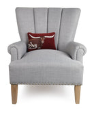 Deep Red Longhorn Hooked Wool Throw Pillow on an armchair, showing the throw pillow at room scale, 8x12 inch