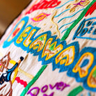 Delaware State Heritage Travel Embroidered Throw Pillow - close-up detail of hand-embroidered needlepoint stitching