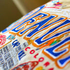 Denver, CO Mile High City Embroidered Travel Pillow - close-up detail of hand-embroidered needlepoint stitching