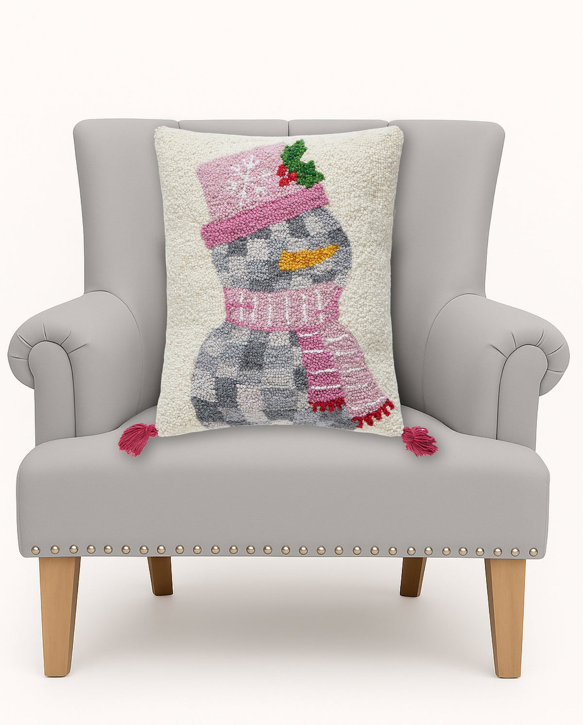 Disco Snowman with Tassels Hooked Wool Christmas Throw Pillow on an armchair, showing the throw pillow at room scale, 14x18 inch