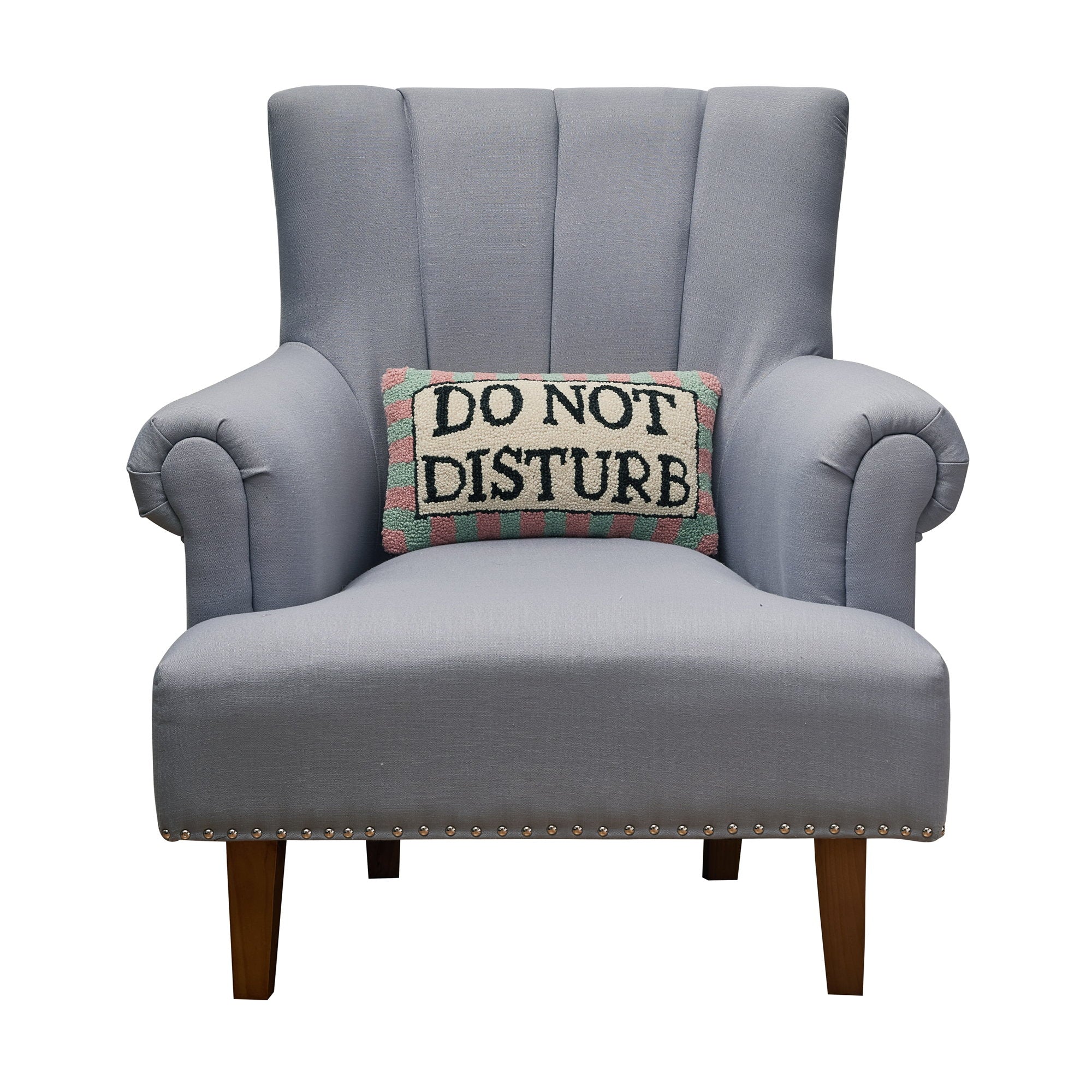 Do Not Disturb Hooked Wool Throw Pillow on an armchair, showing the throw pillow at room scale, 9x16 inch