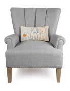 Dog Silhouettes Hooked Wool Throw Pillow on an armchair, showing the throw pillow at room scale, 9x16 inch