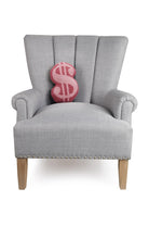 Dollar Sign Shaped Hooked Wool Throw Pillow on an armchair, showing the throw pillow at room scale, 8x12 inch