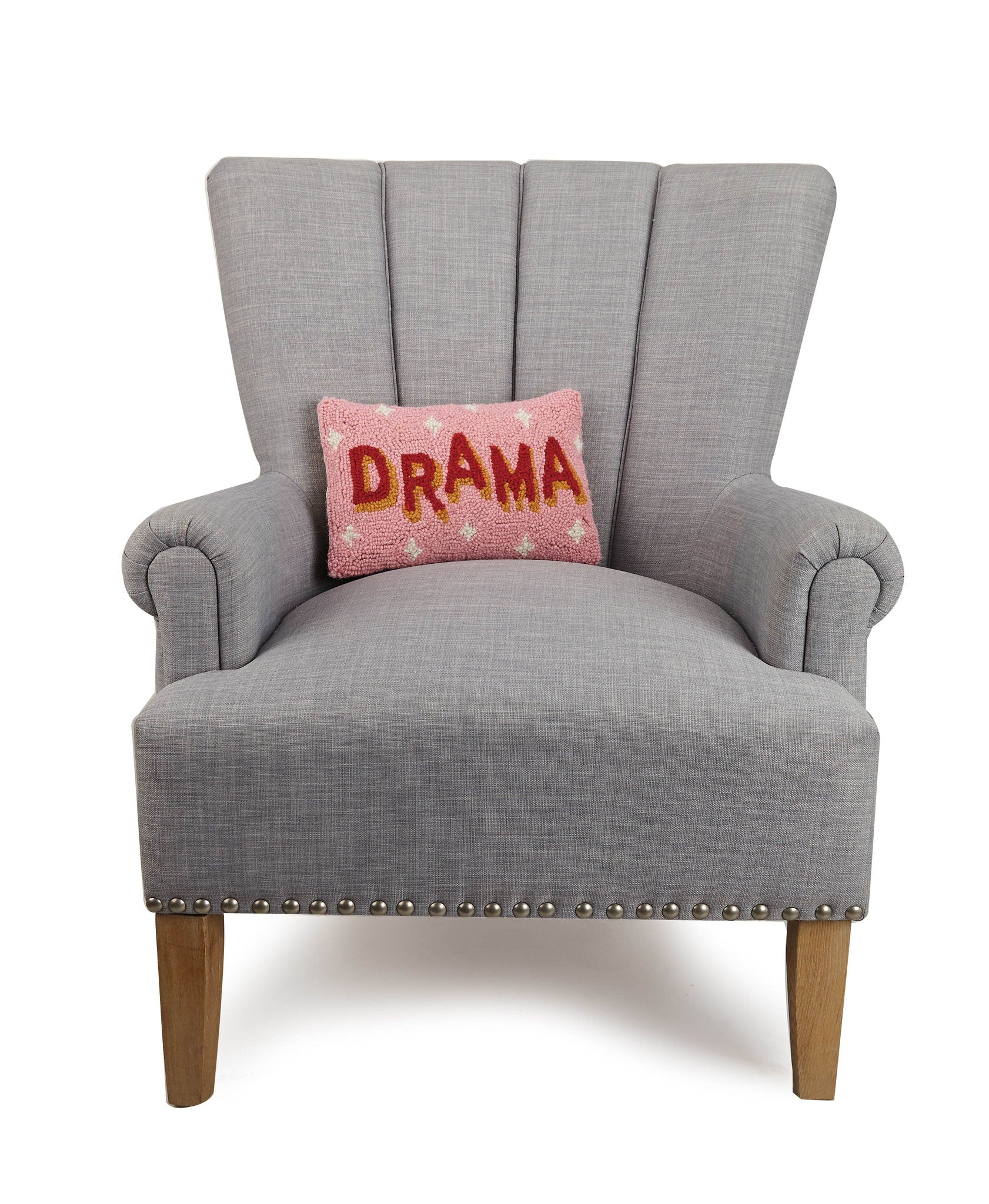 Drama Hooked Wool Throw Pillow on an armchair, showing the throw pillow at room scale, 8x12 inch