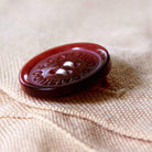 Empire State Building XL Embroidered Travel Throw Pillow - detail of decorative button closure