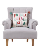 Fa La La La with Tassels Hooked Wool Christmas Throw Pillow on an armchair, showing the throw pillow at room scale, 16x16 inch