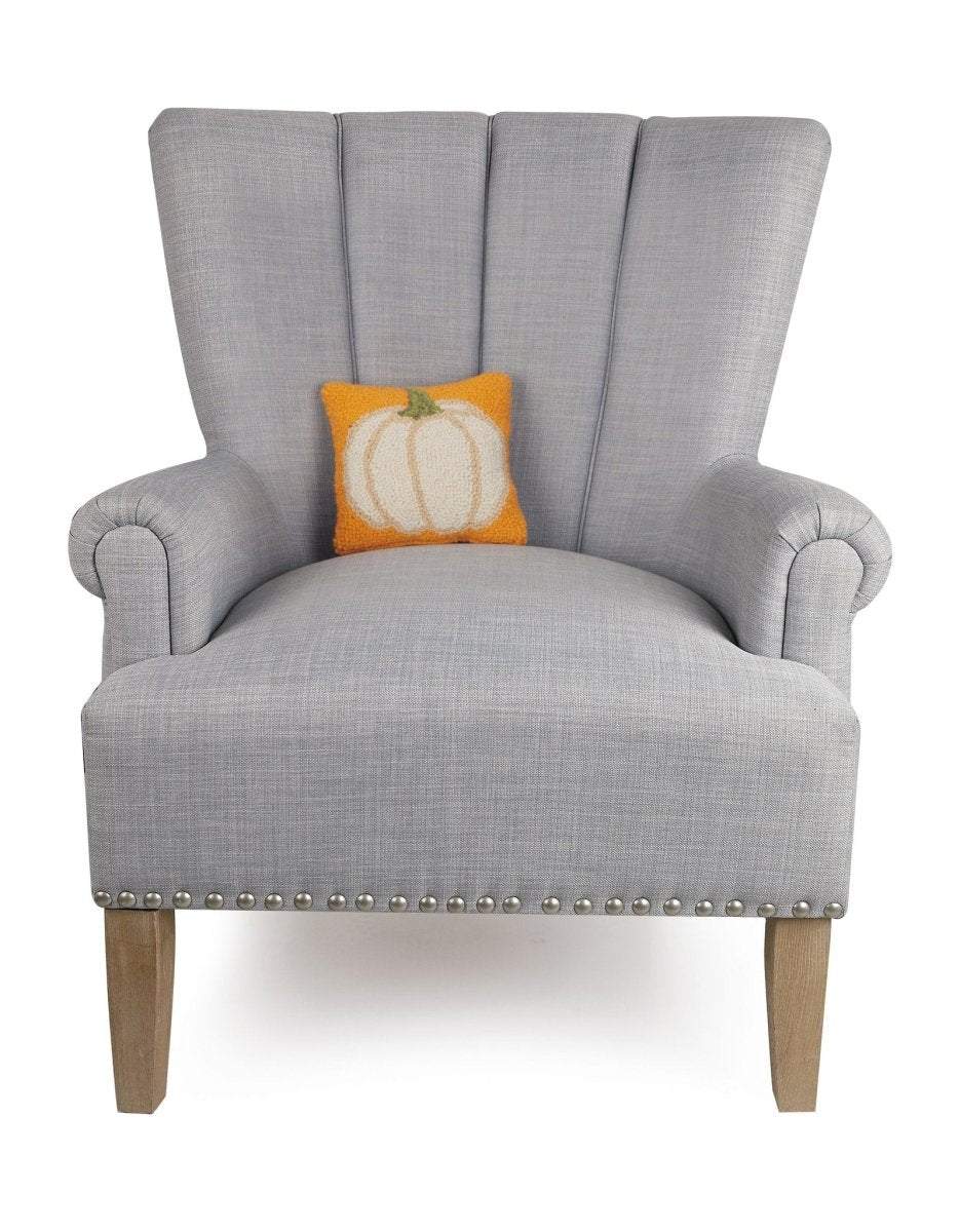 Fall Pumpkin Hooked Wool Throw Pillow on an armchair, showing the throw pillow at room scale, 8x8 inch