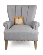 Fall Pumpkin Hooked Wool Throw Pillow on an armchair, showing the throw pillow at room scale, 8x8 inch