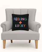Feeling Lucky Hooked Wool Throw Pillow on an armchair, showing the throw pillow at room scale, 14x14 inch