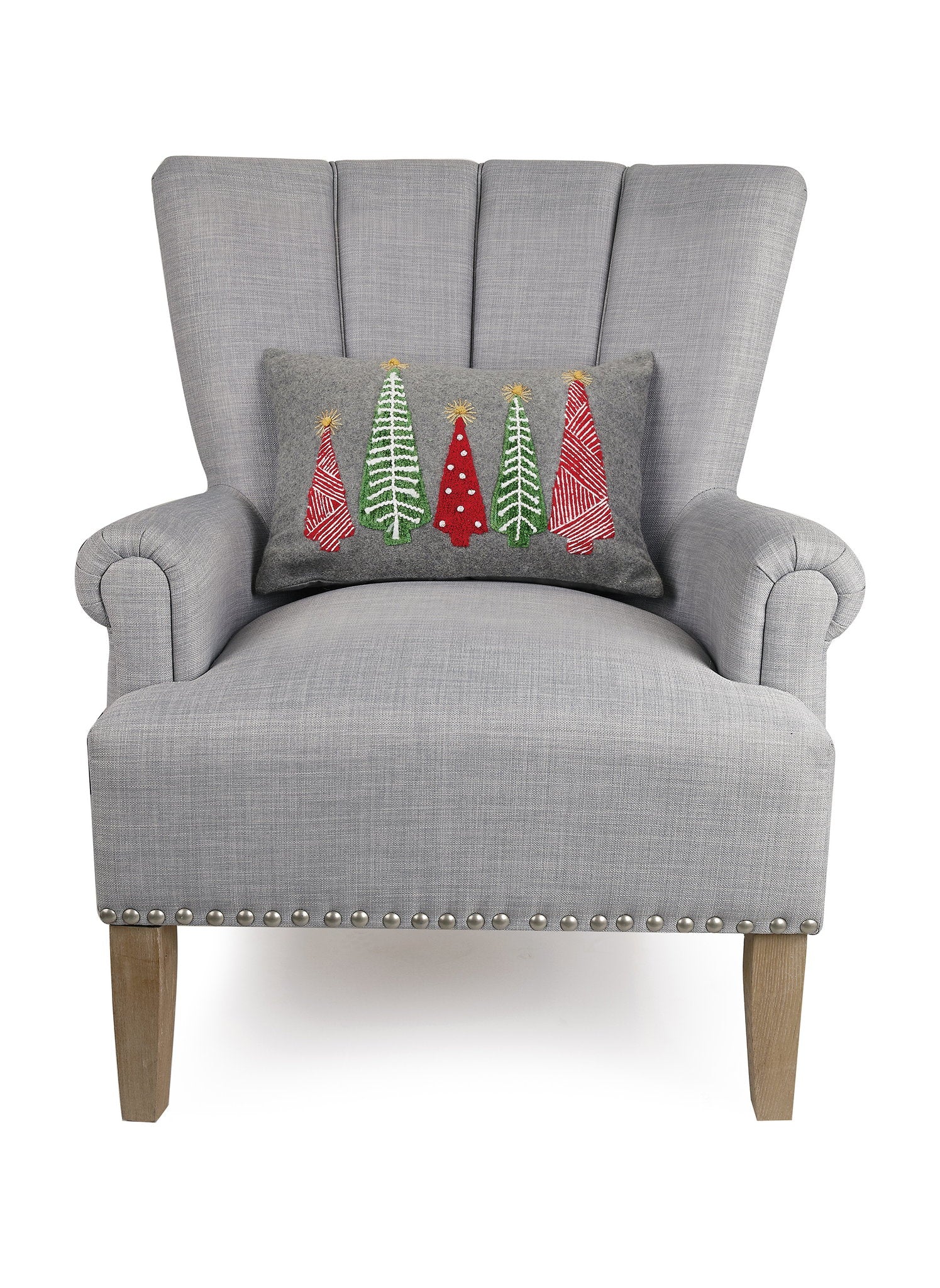 Felt Christmas Tree Embroidered Throw Pillow on an armchair, showing the throw pillow at room scale, 12x18 inch