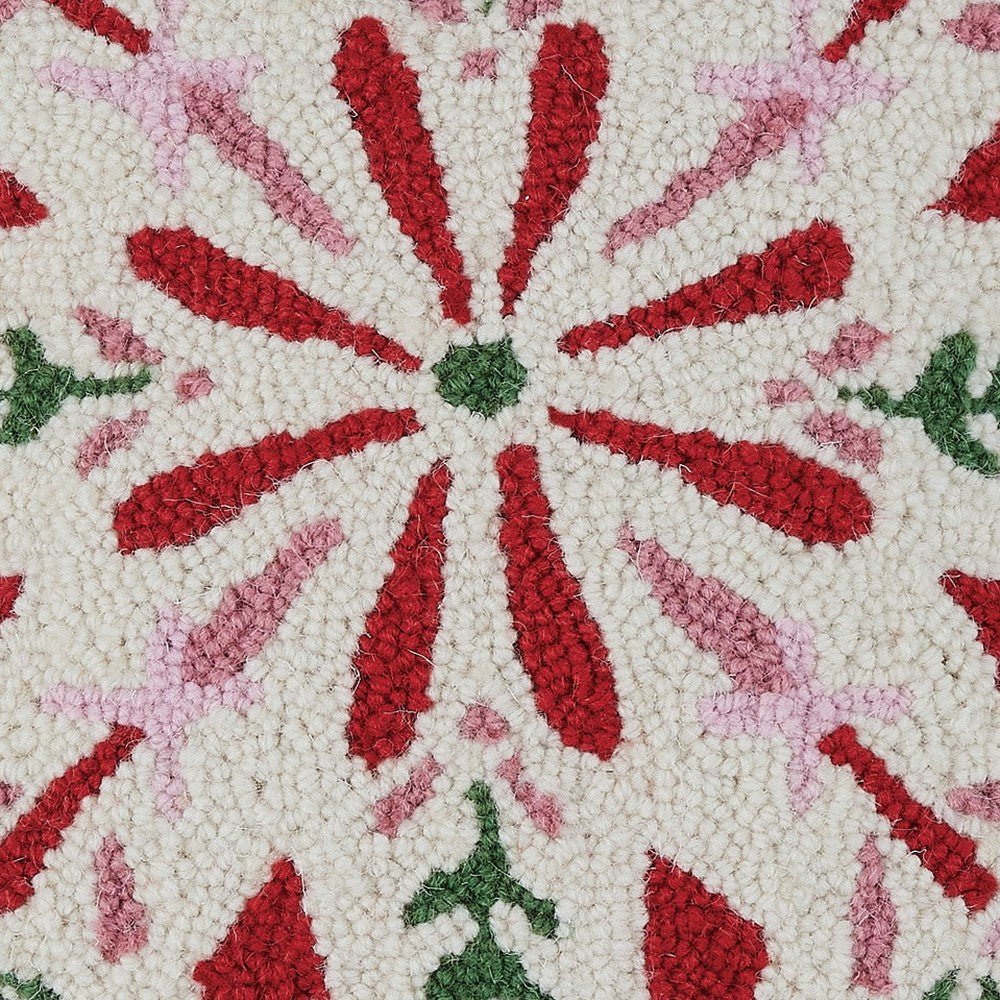 Closeup of Festive Folk Snowflake Hooked Wool Christmas Throw Pillow showing stitch texture and craftsmanship detail