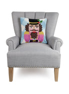 Festive Gingham Nutcracker Hooked Wool Christmas Throw Pillow on an armchair, showing the throw pillow at room scale, 16x16 inch