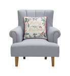 Festive Greenery Embroidered Christmas Throw Pillow on an armchair, showing the throw pillow at room scale, 18x18 inch