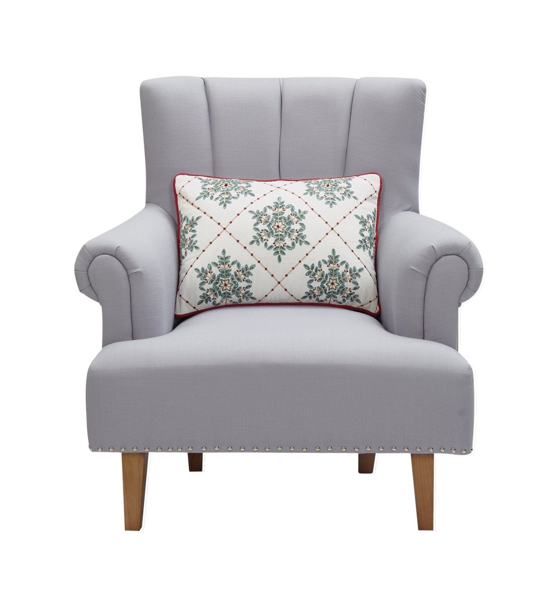 Festive Greenery Snowflakes Embroidered Christmas Throw Pillow on an armchair, showing the throw pillow at room scale, 14x20 inch