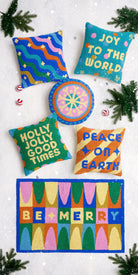 Festive Mandala Hooked Wool Christmas Throw Pillow shown alongside other designs in the same collection, 16x16 inch