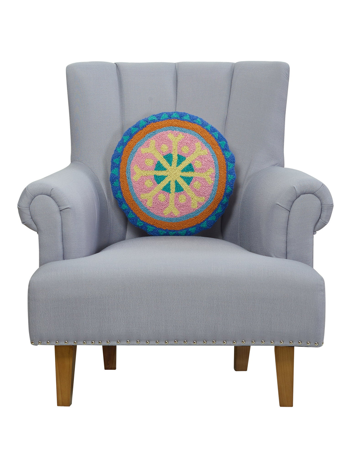 Festive Mandala Hooked Wool Christmas Throw Pillow on an armchair, showing the throw pillow at room scale, 16x16 inch