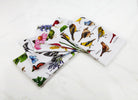 Field Guide Herbs Flour Sack Kitchen Towel shown alongside other designs in the same collection, 18x25 inch