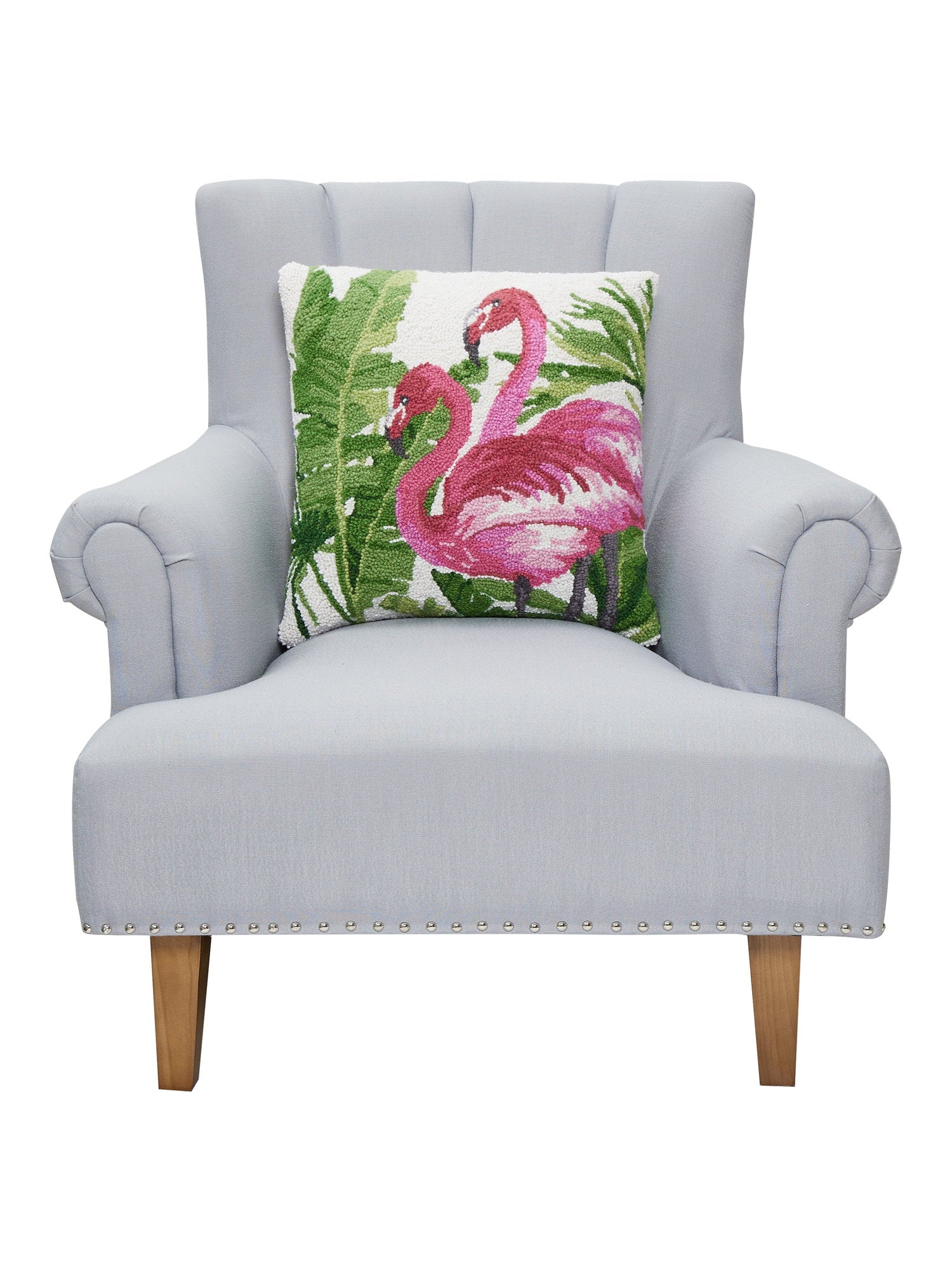 Flamingo Tropics Hooked Wool Throw Pillow on an armchair, showing the throw pillow at room scale, 18x18 inch